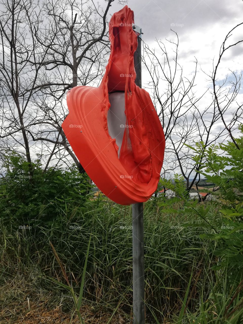 Parabolic mirror for road traffic melted by the sun