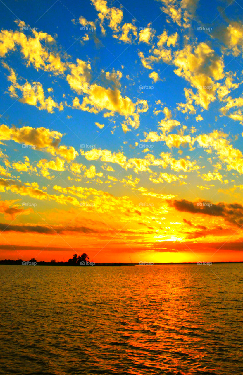 Idyllic view of sea against dramatic sky