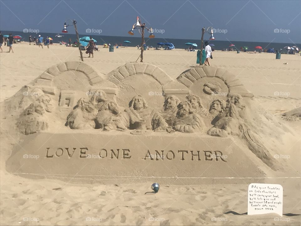 Love one another biblical beach art