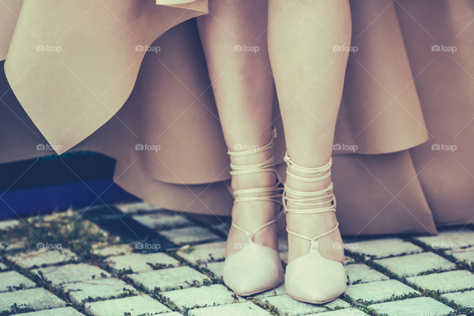 Fashion Woman Legs And Feet Wearing Shoes And Evening Dress