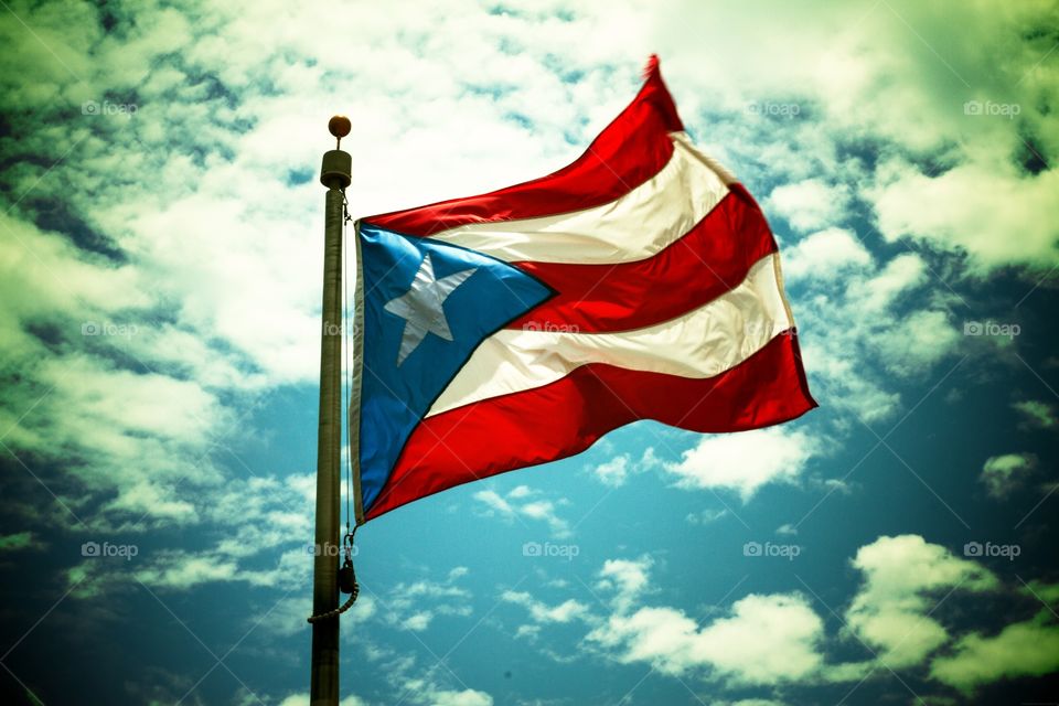 Puerto Rico's Bandera . Taken from my first trip to Puerto Rico and the first place was the pier where the flag flew proudly.