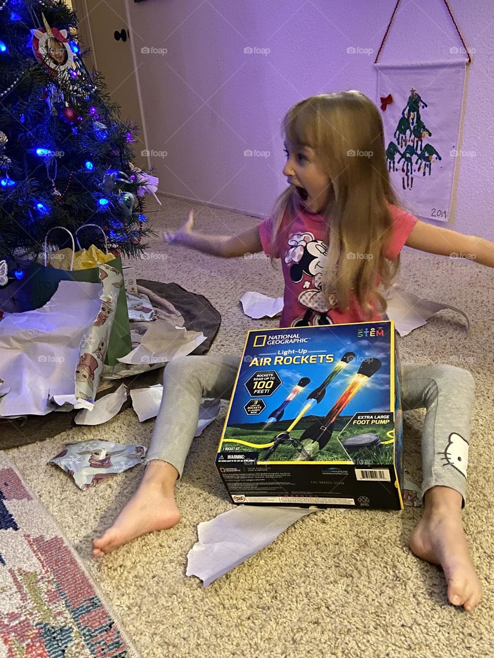 Pure joy, and excitement little girl opens Christmas gifts!