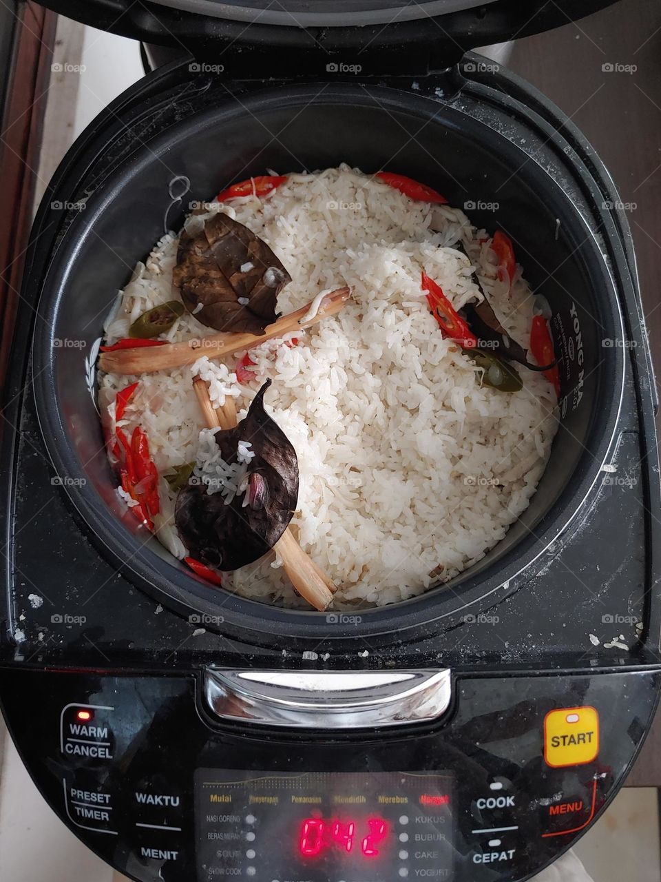 Nasi Liwet : Made from rice seasoned with spices, coconut milk, chili and topped with small anchovies.