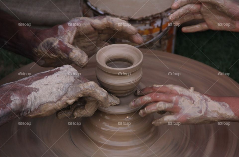 Best photo of Potter and his pottery wheel