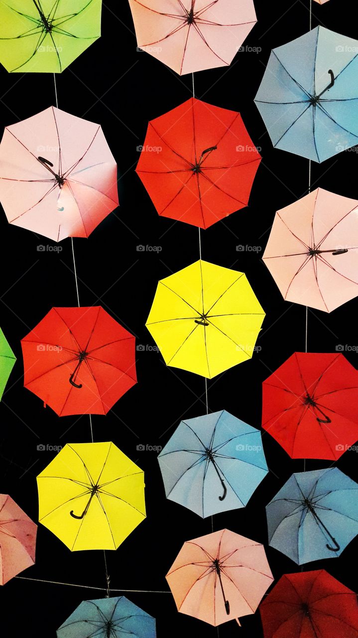 umbrella. umbrella hanging from a rope at the top