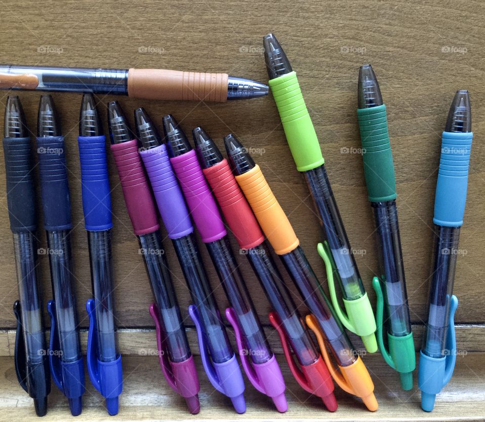 Colorful pens on drafting table 