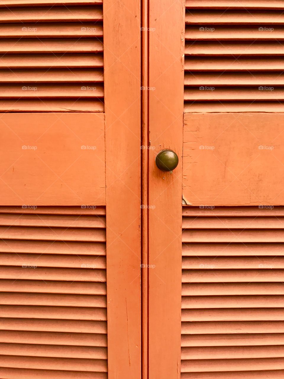 Close-up knob on orange shutters