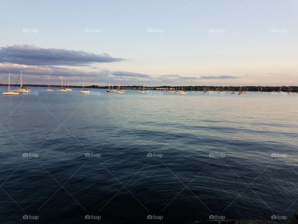 A fleet of sail boats sit in the Raritan bay in Perth Amboy, Nj.