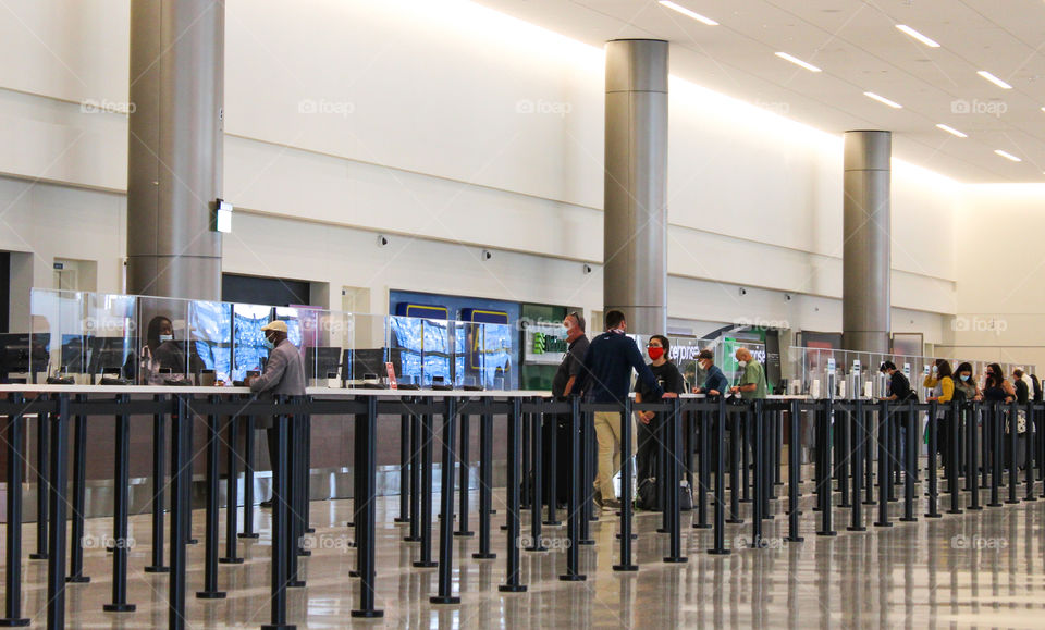 People wearing masks in the airport 