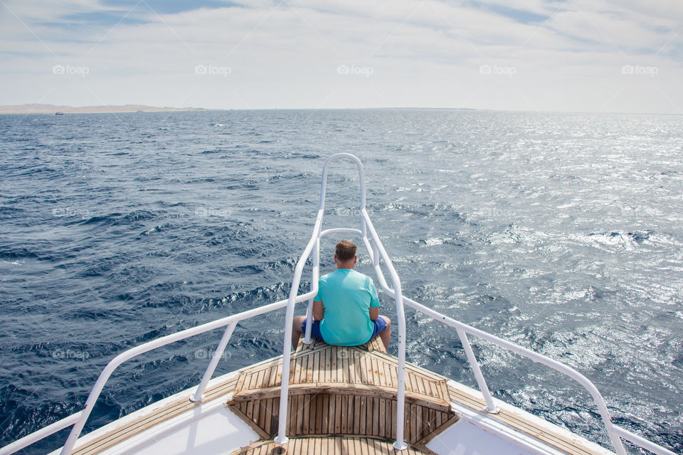 Exploring the sea from the front point of the boat.