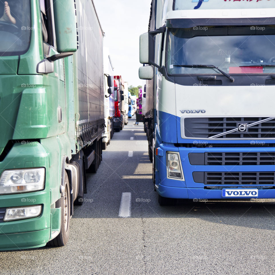 Trucks stuck. Trucks on the highway queueing while trafic jam