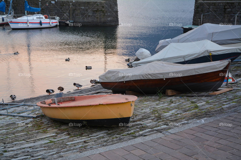 Boats moored at the harbor of Argegno, Como, Lombardy, Italy.