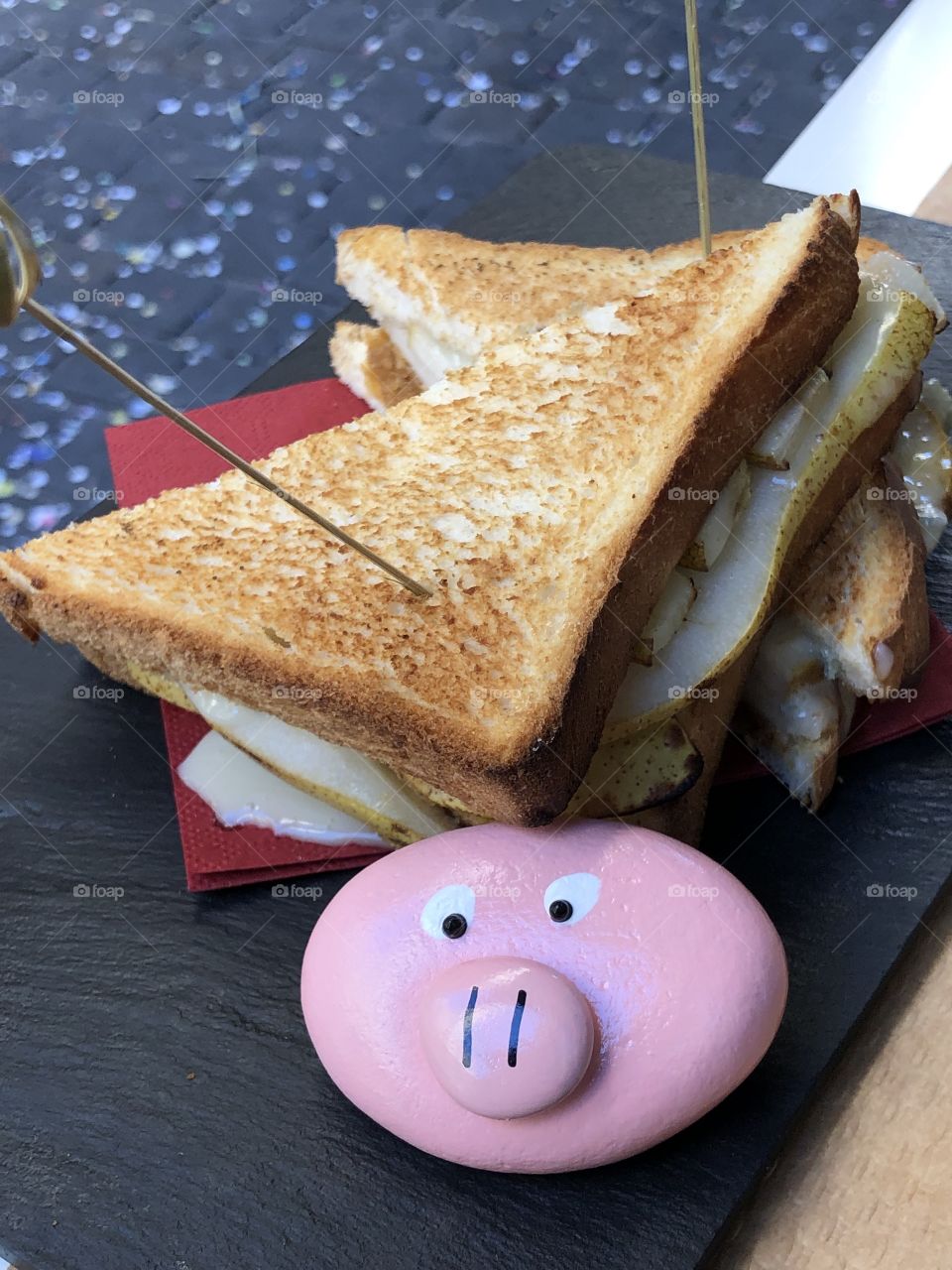 Croque-monsieur, typical french sandwich with a funny pink pig stone