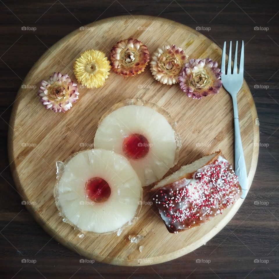 pine apple jelly and a slice of home-made cake .