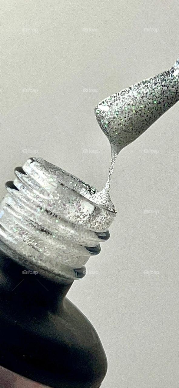 White with multicolor glitter nail polish