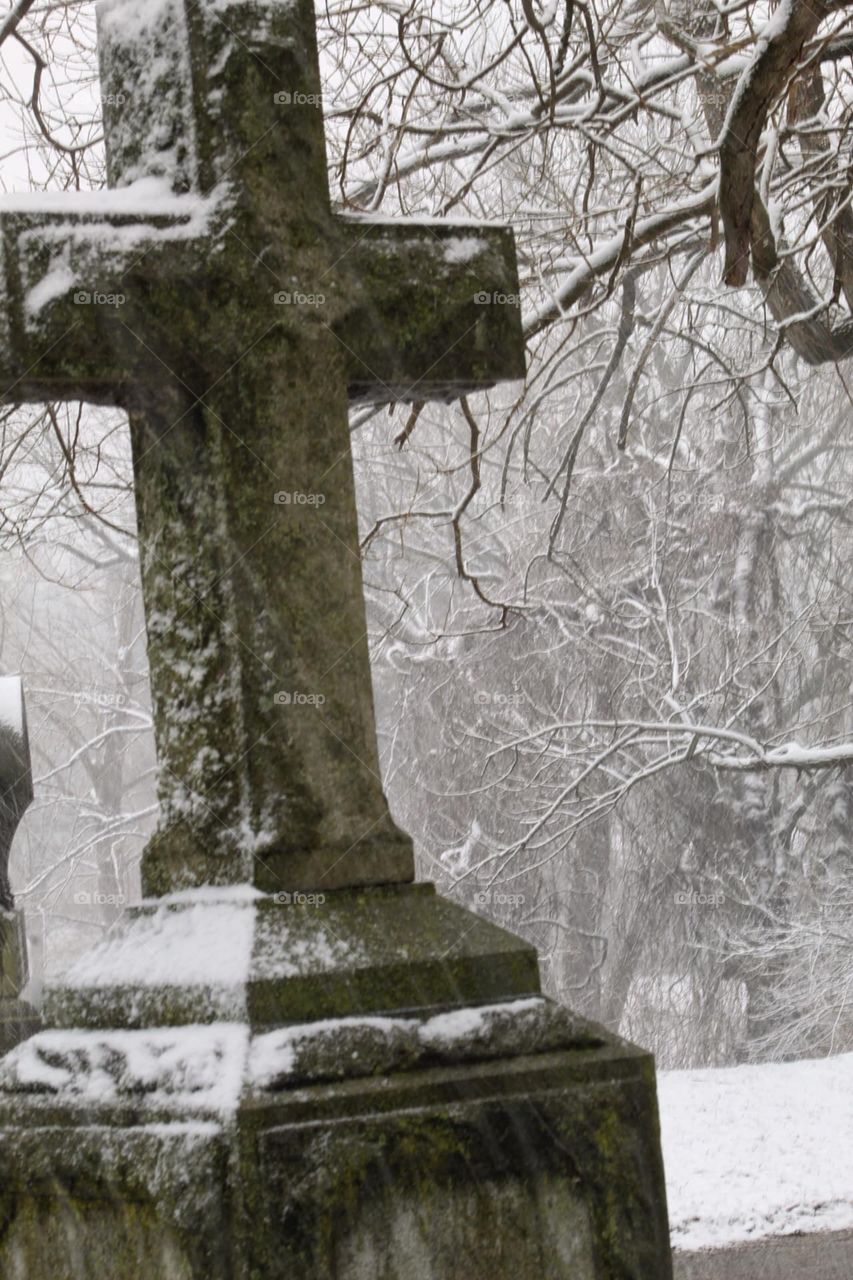 Cold snowy gray day in the cemetery 