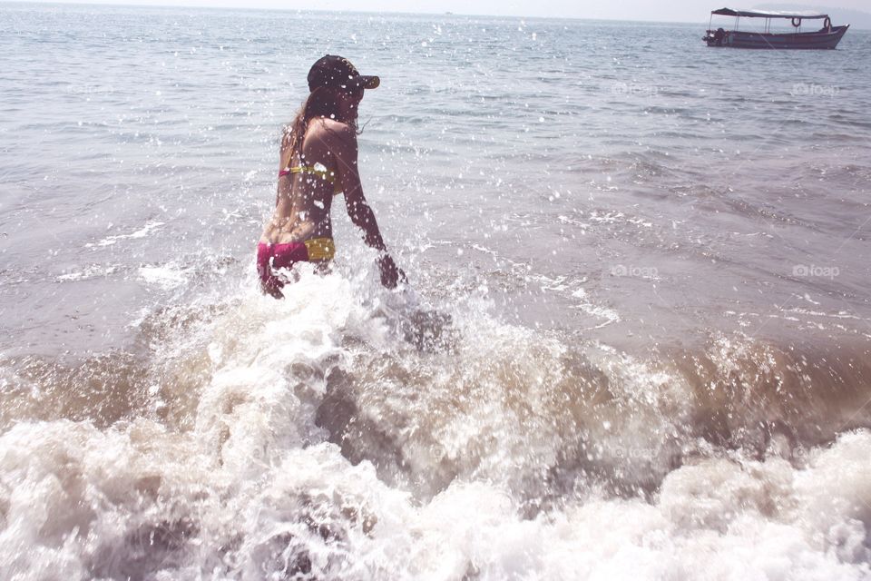 girl in the sea, india and waves