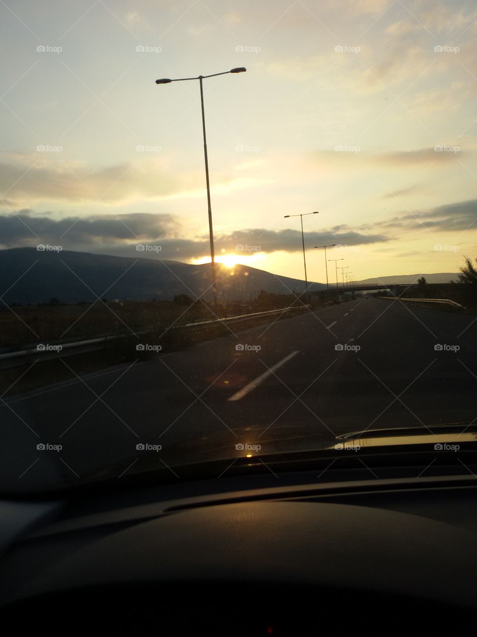 Sunset on the highway from car