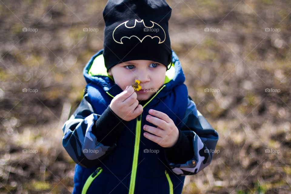 boy on a walk in spring, flowers