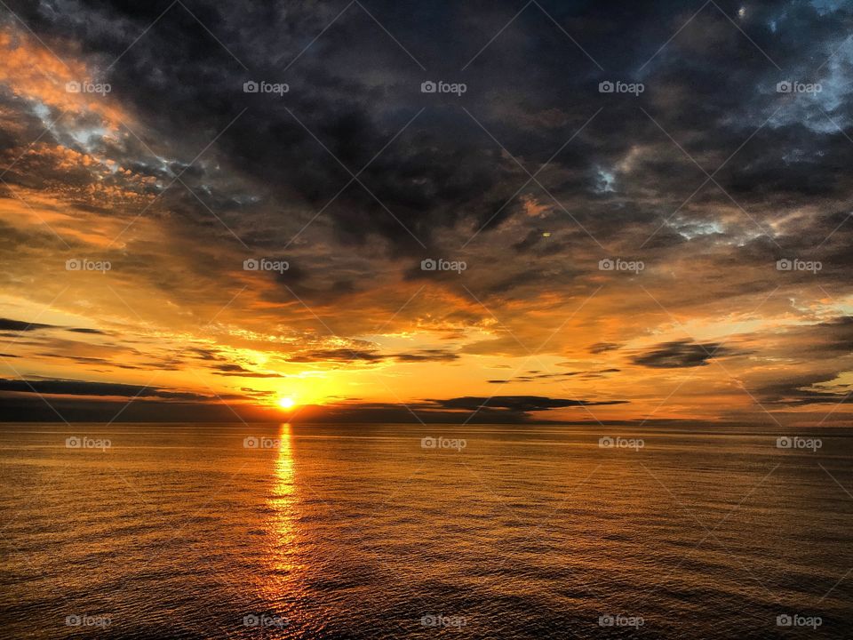 Scenic view of a sea against dramatic sky