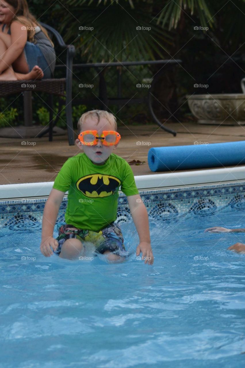 Portrait of cute boy in swimming pool
