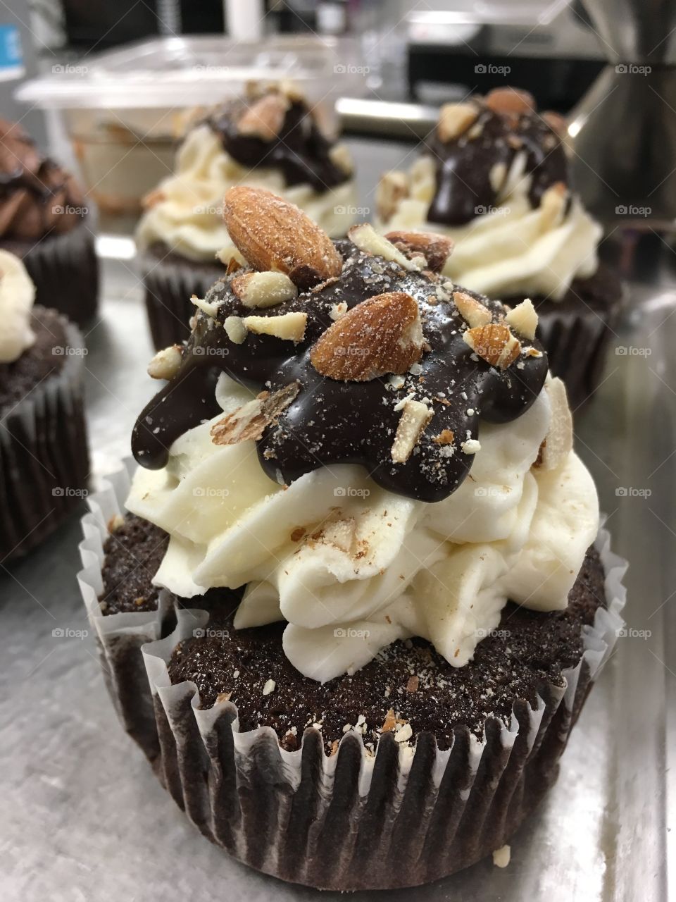 Almond Joy Cupcakes! My favorite! Chocolate cake, coconut frosting topped with melted chocolate, and chopped almonds!