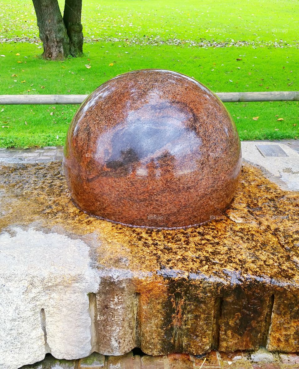 Marble ball. It is a free turning marble ball in a park in Zurich. One can easily rotate the ball by hand using little force, and it