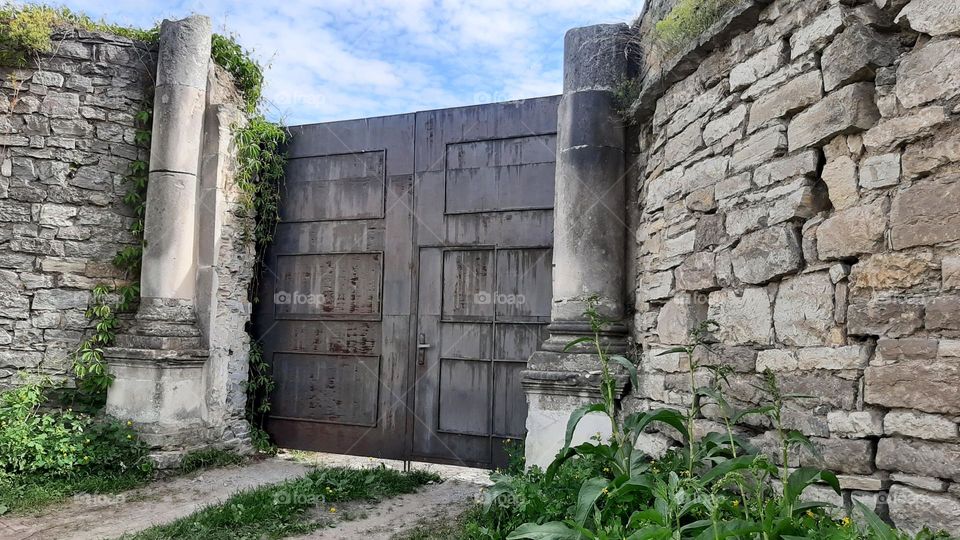 old gate in stone wall