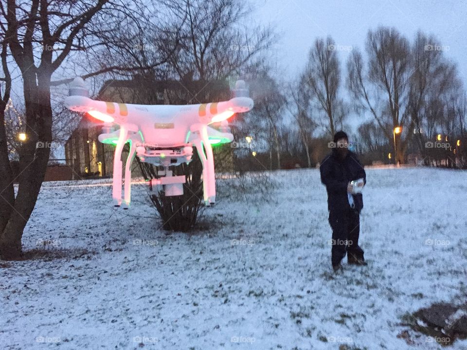 Pilot flying a Drone in the winter. Phantom Professional 3.