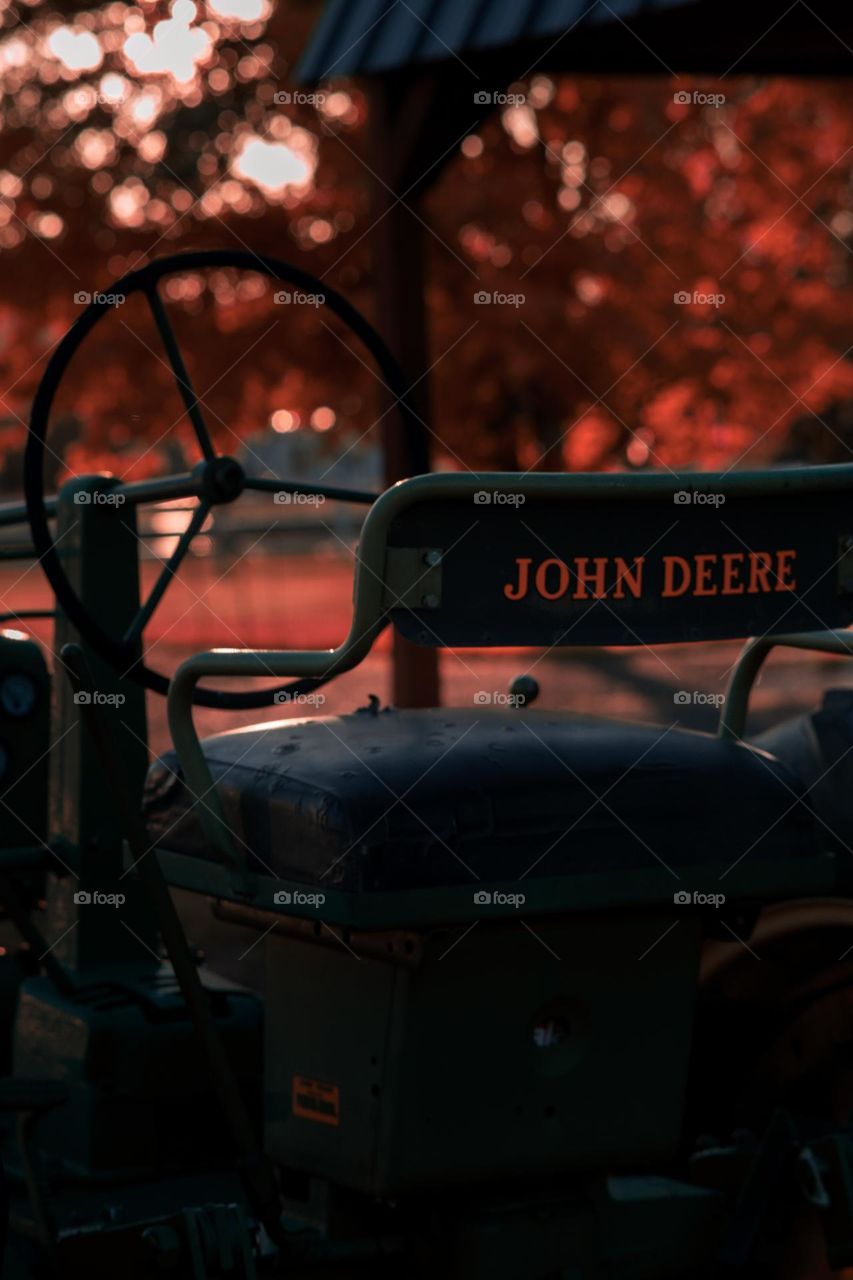 John Deere tractor in red haze.