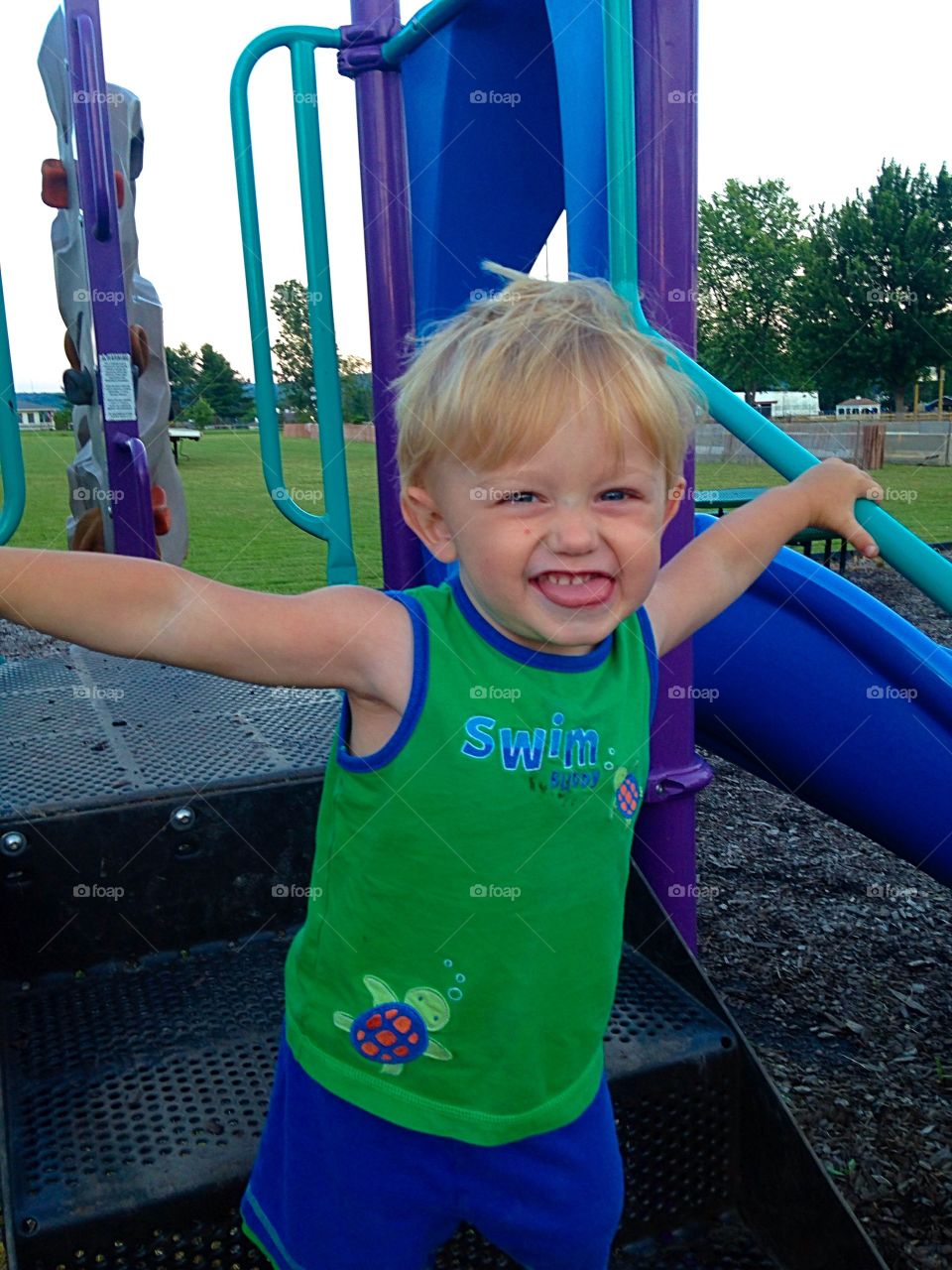 Small boy playing in park