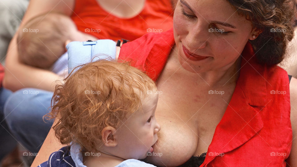 Mothers feed their infants on breast milk inManhattan, NYC