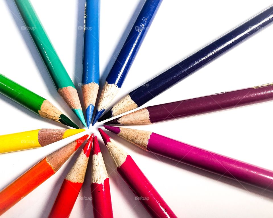 circular arrangement of colored pencils