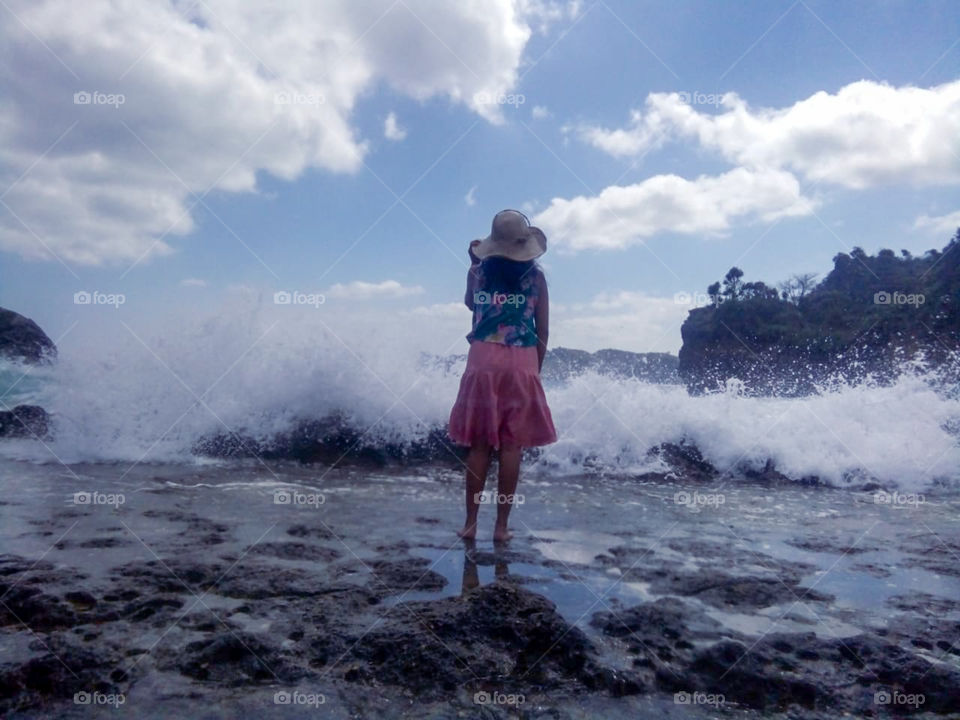 waves splashing on a beach in East Java, Indonesia