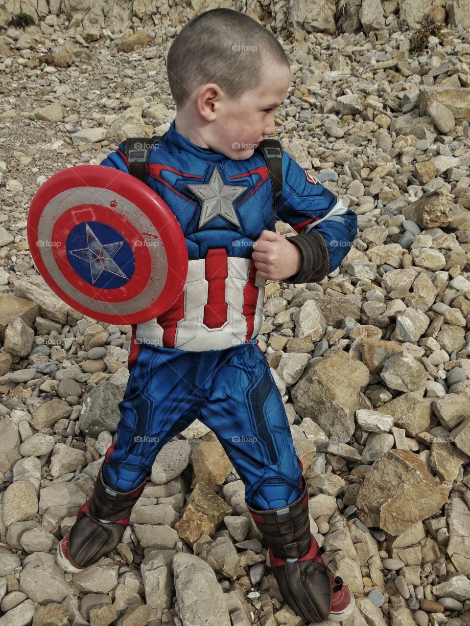 Boy wearing superhero costume