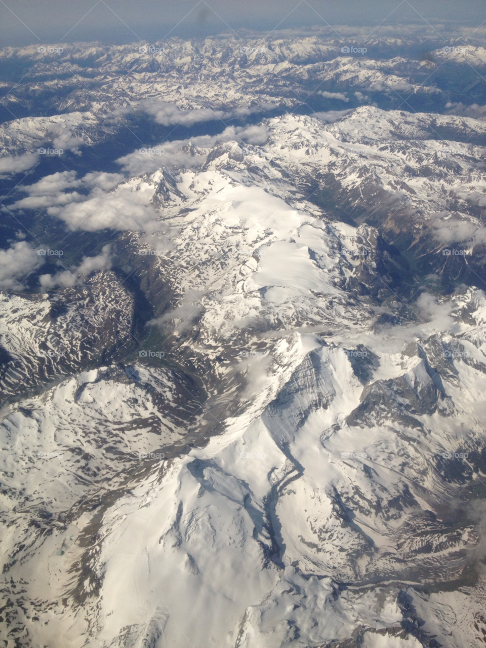 snow clouds airplane mountains by Zestine