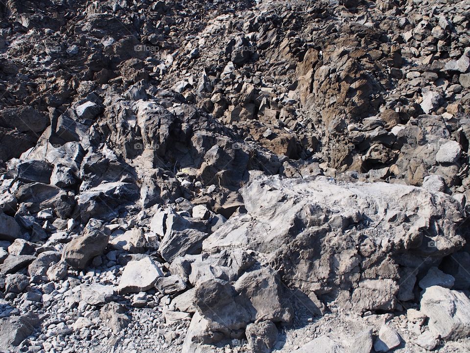 The rugged terrain of the jagged rocks at the Big Obsidian Flow in the Newberry National Volcanic Monument in Central Oregon in the fall. 