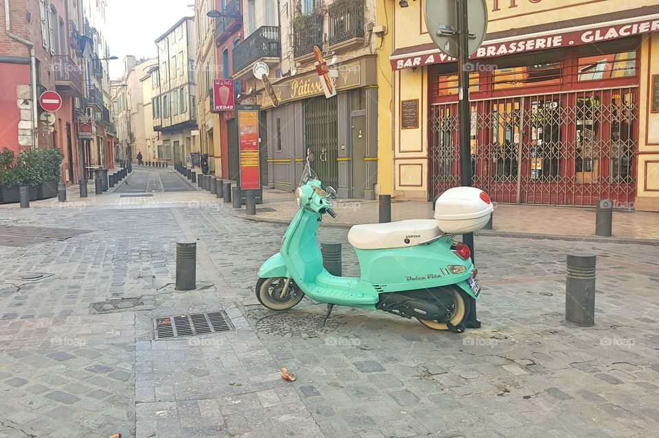 scooter in empty street at Perpignan