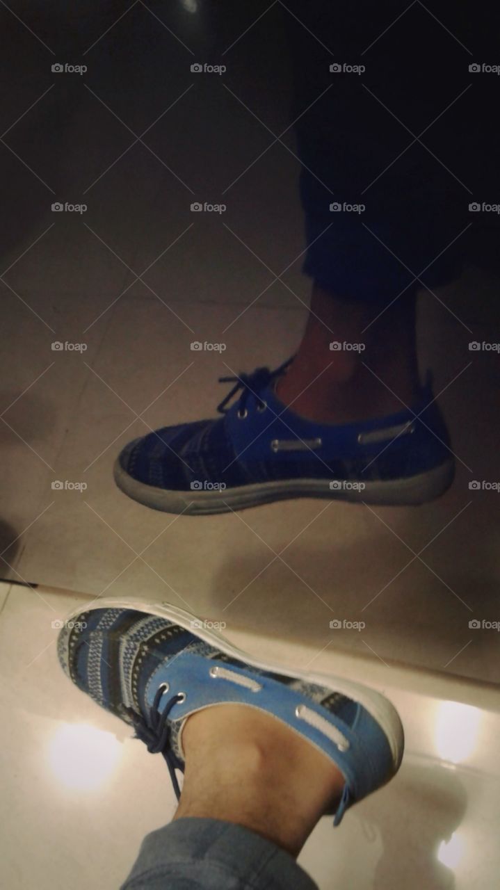 Reflection of a blue shoe.