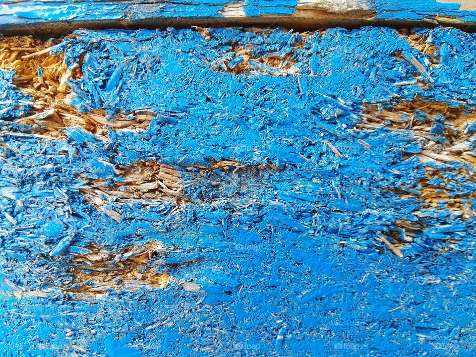 Wooden boards with splinters painted blue