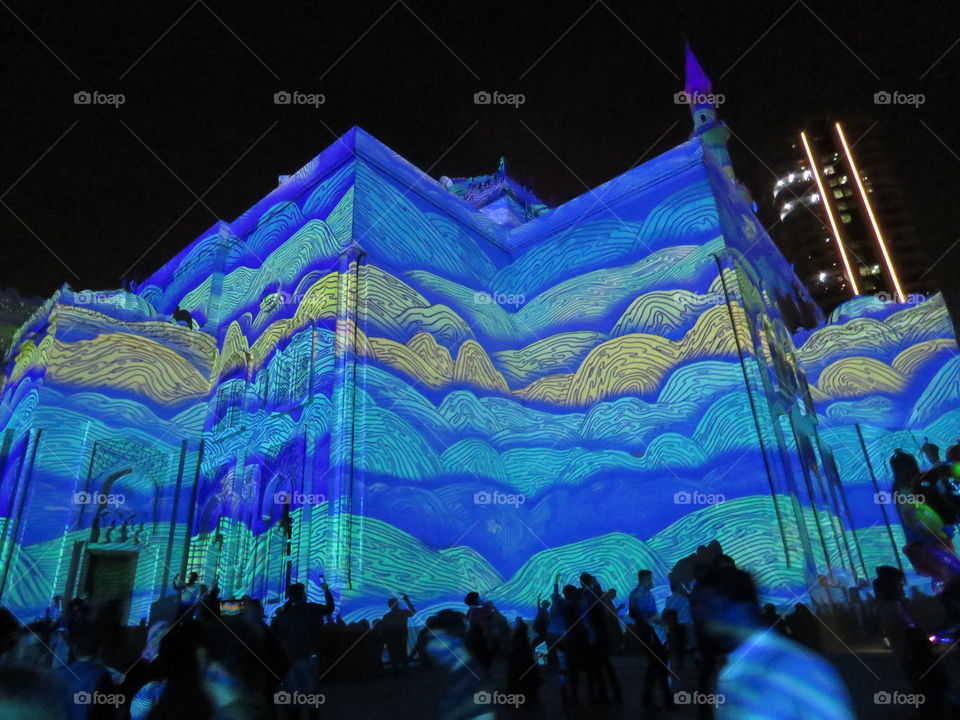 Side view of laser projected mosque at festival.