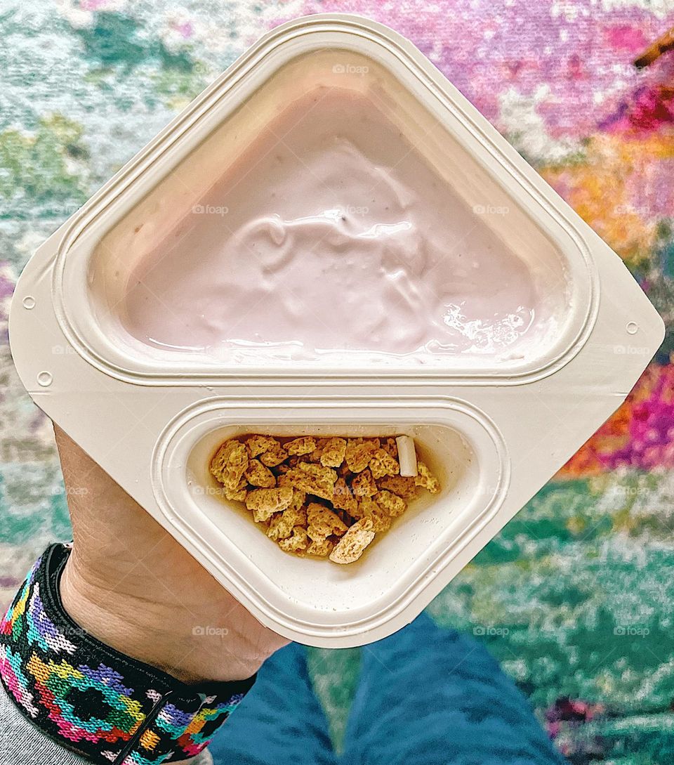 Triangle shaped yogurt containers, woman holding Greek yogurt container, eating Greek yogurt, triangles in everyday objects, triangles in food, Chobani yogurt container 