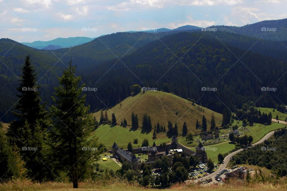 A beautiful view over the hills and the medieval monastery of Sucevița,one of the beautiful sights of Bucovina.