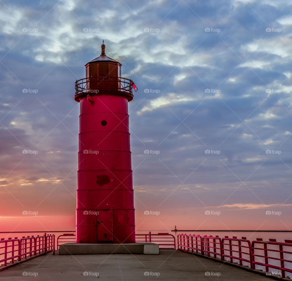 Read lighthouse at sunrise. Read lighthouse chicken at sunrise on Lake Michigan in Wisconsin