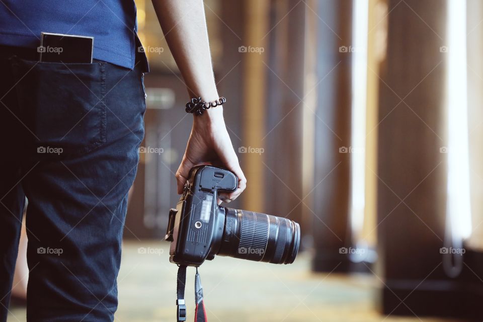 Camera in woman hand.
