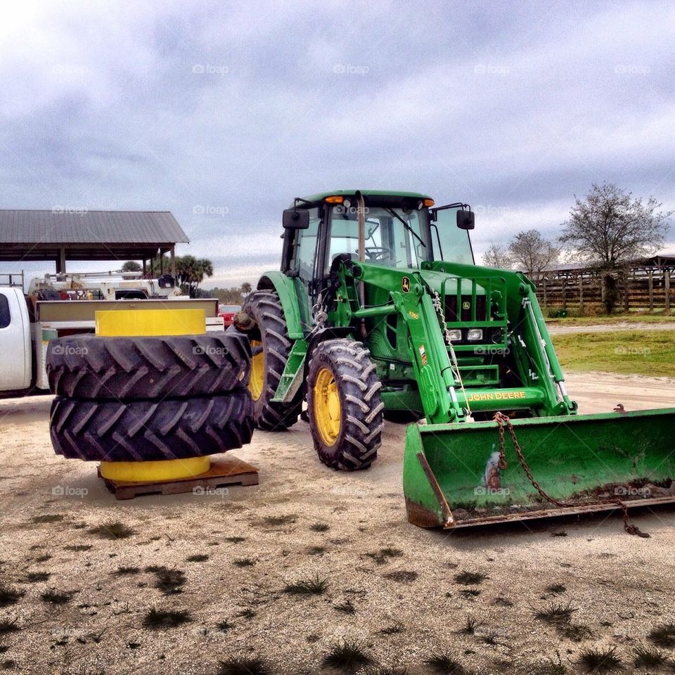 John Deere tractor getting new tires