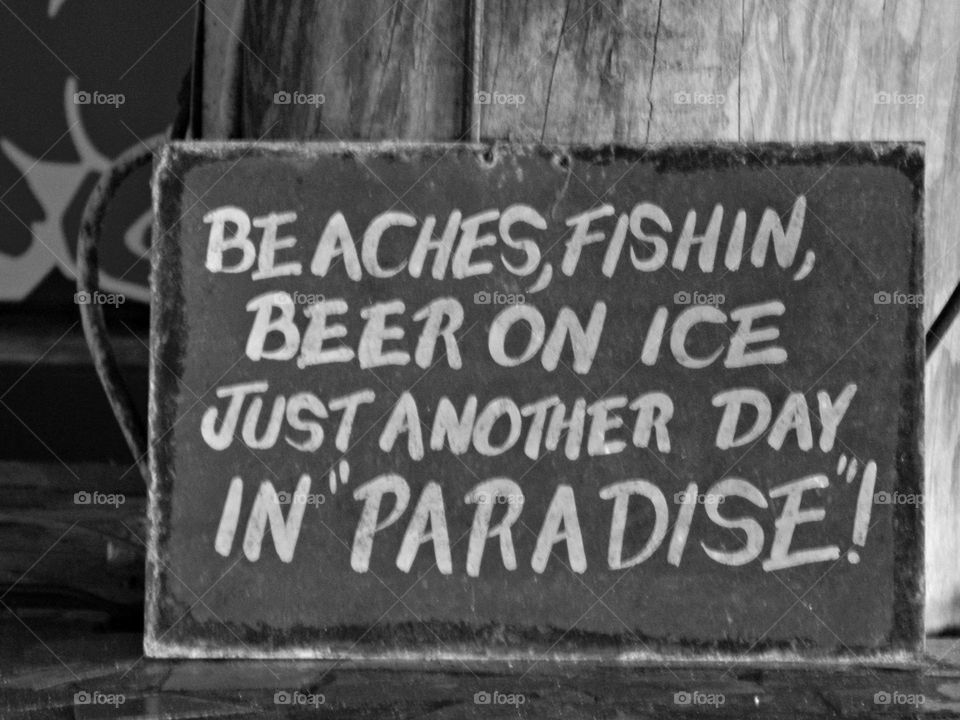 Vintage Vibes: A vintage sign hanging in a restaurant on the beach- self explanatory 
