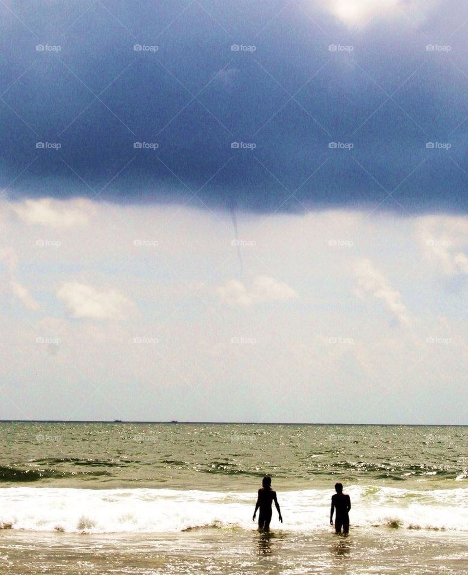 beach tornado cloudy india by mariemank