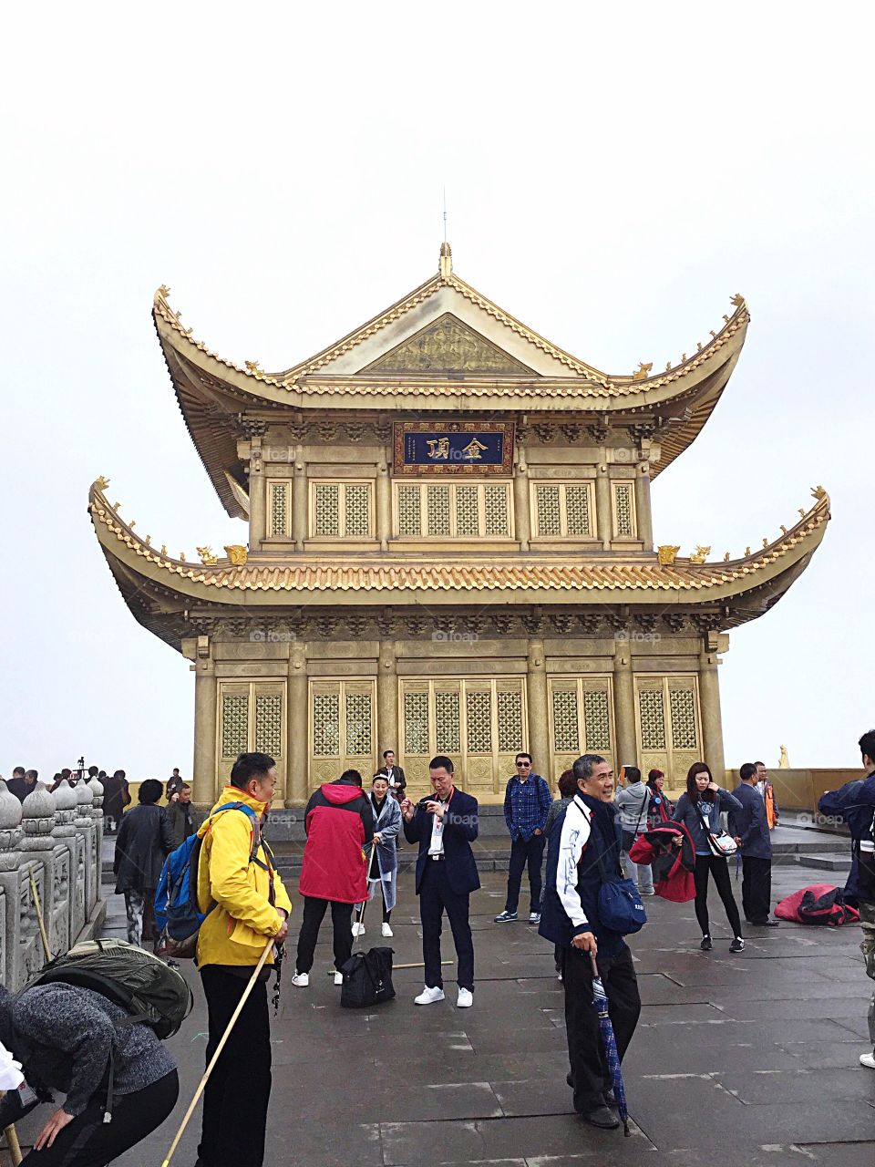 Peoples interaction at the gold temple on top of Emei mountain 