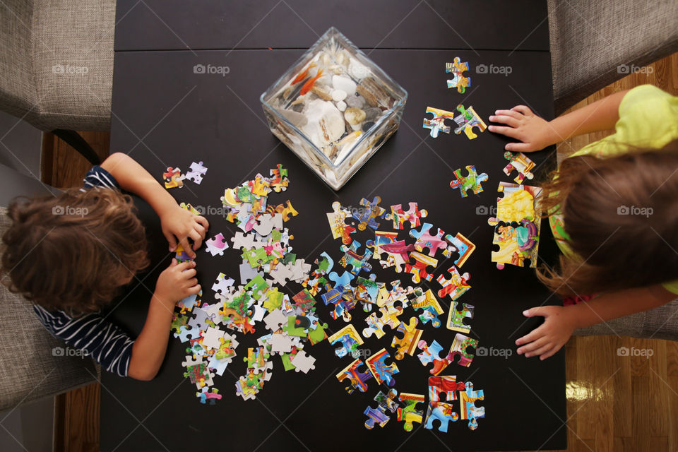 Children playing with puzzles